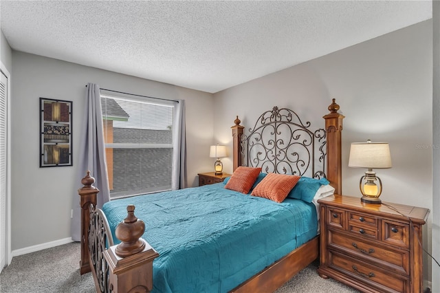 bedroom featuring carpet and a textured ceiling