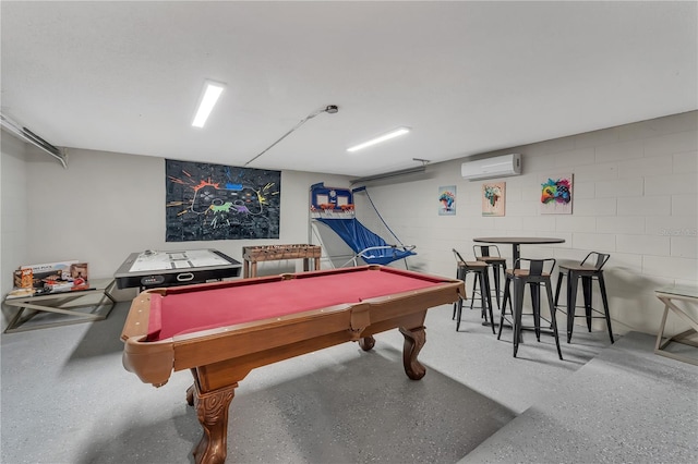 rec room featuring an AC wall unit and billiards