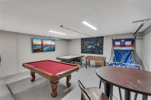 recreation room featuring a textured ceiling and pool table