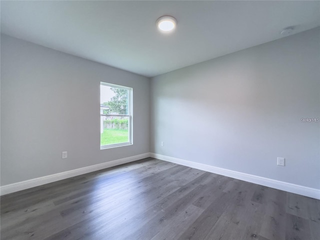 unfurnished room featuring dark hardwood / wood-style floors