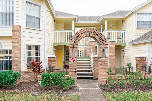 view of front of house with a balcony