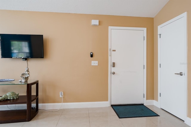 entryway with light tile flooring