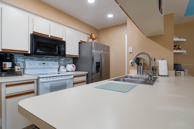 kitchen with white range with electric stovetop, stainless steel fridge with ice dispenser, tasteful backsplash, white cabinetry, and sink