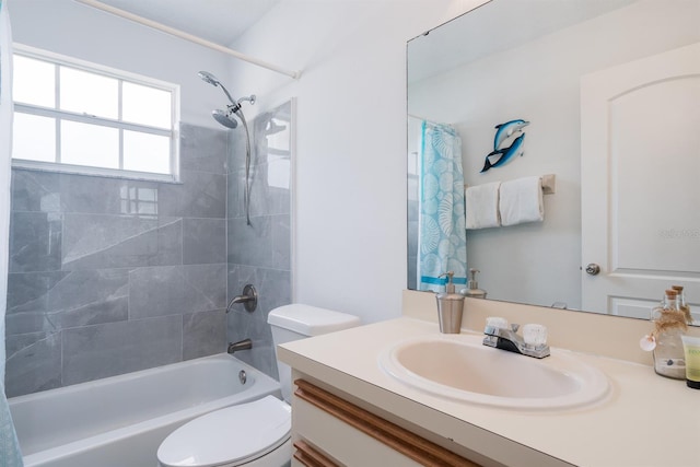 full bathroom with shower / tub combo, vanity, and toilet