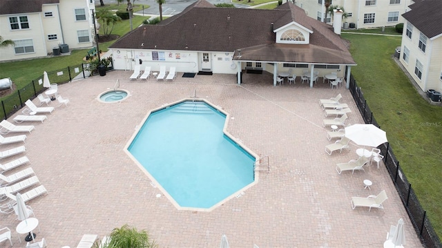 view of pool featuring a gazebo, a patio area, central air condition unit, and a lawn