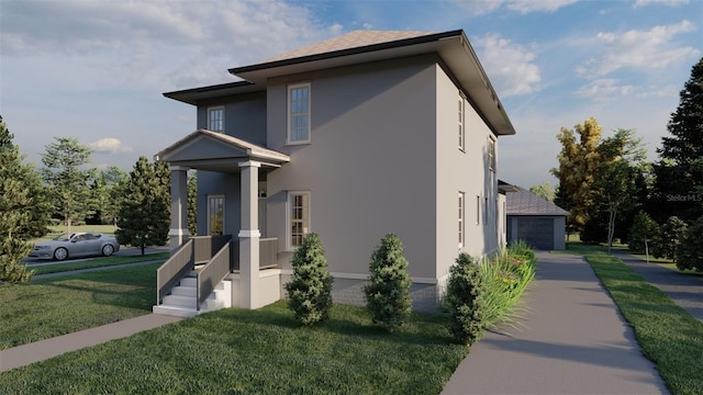 view of side of home featuring an outbuilding, a yard, covered porch, and a garage