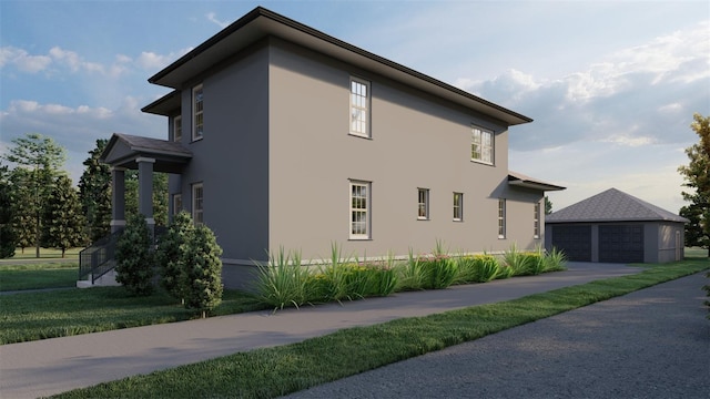 view of property exterior featuring an outbuilding and a garage