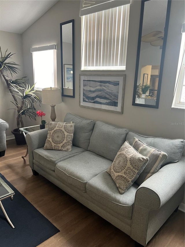 8713 SW Rockingham Ter Unit D, Kissimmee, FL 34747 - living area featuring wood finished floors and lofted ceiling