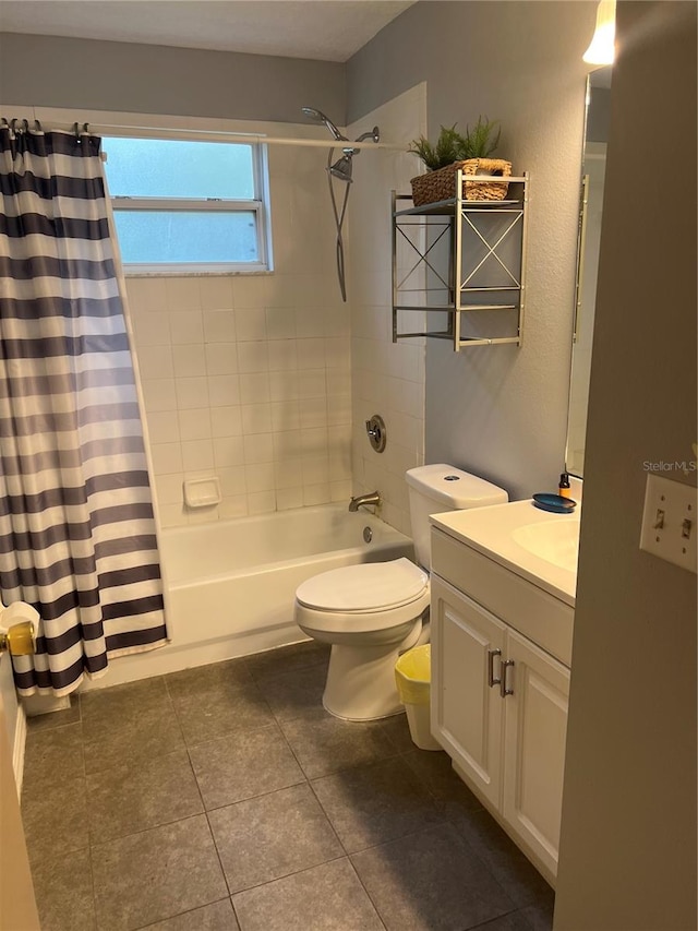 full bathroom featuring shower / bath combo with shower curtain, vanity, tile patterned floors, and toilet