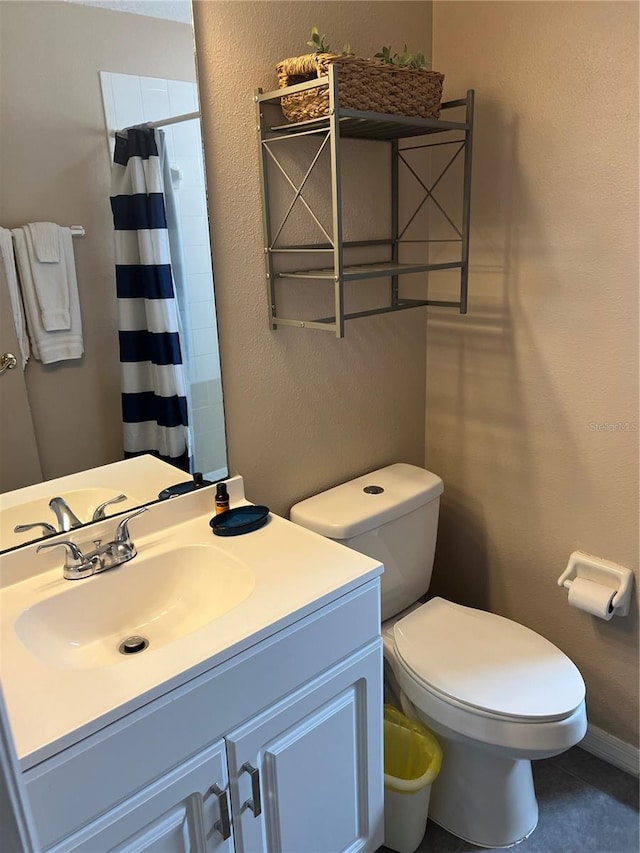 8713 SW Rockingham Ter Unit D, Kissimmee, FL 34747 - bathroom featuring toilet, vanity, and curtained shower