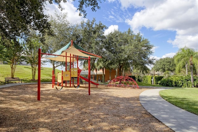 view of jungle gym featuring a lawn