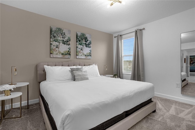 carpeted bedroom with a textured ceiling