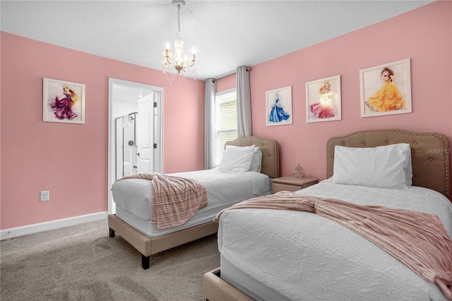 carpeted bedroom with a chandelier and a textured ceiling