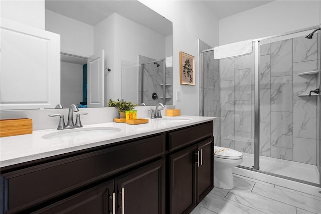 bathroom featuring toilet, vanity, and walk in shower