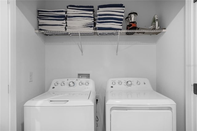 clothes washing area featuring washing machine and dryer