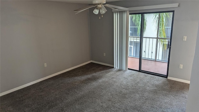 empty room with dark colored carpet and ceiling fan