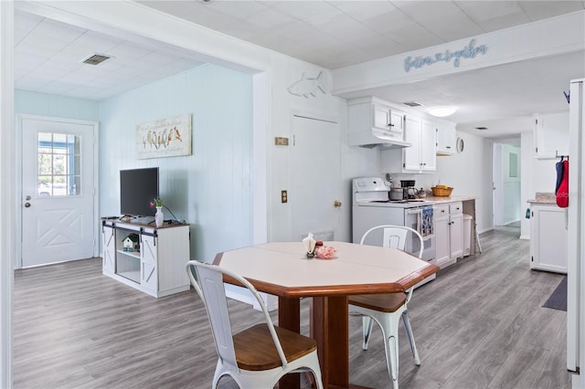 dining room with light wood-type flooring