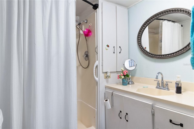 bathroom with a shower with curtain and vanity