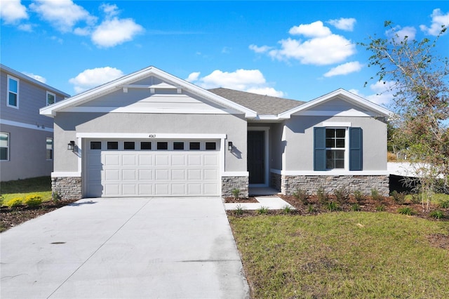 craftsman inspired home with a garage and a front yard