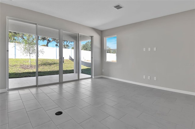 spare room with light tile patterned floors