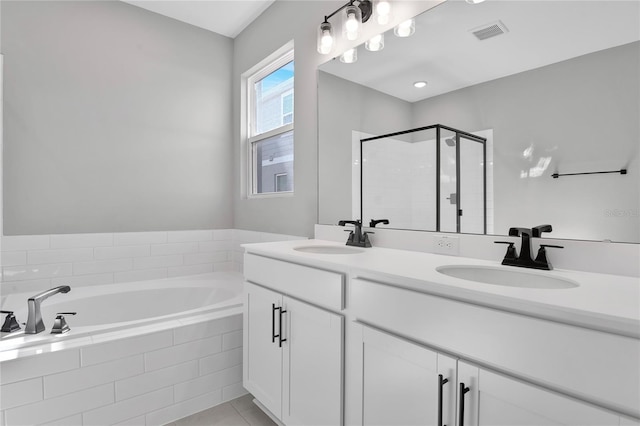 bathroom featuring tile patterned flooring, vanity, and independent shower and bath