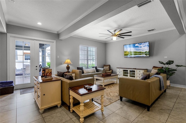 tiled living room with crown molding, french doors, and a textured ceiling