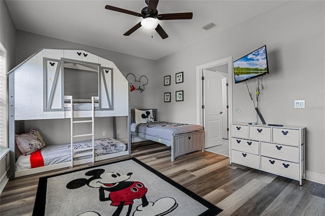 bedroom with dark wood-type flooring and ceiling fan