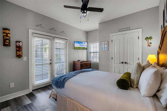 bedroom featuring dark hardwood / wood-style flooring, access to outside, a closet, and ceiling fan