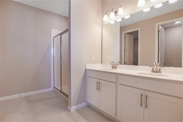 bathroom featuring vanity and a shower with shower door