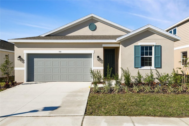 single story home featuring a front yard and a garage