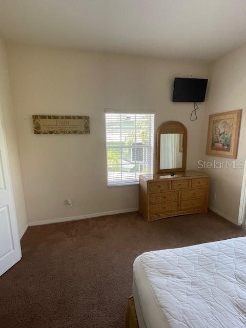 unfurnished bedroom with carpet