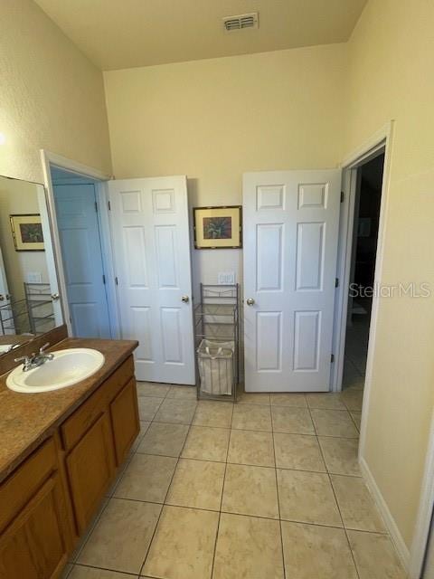 bathroom featuring vanity and tile patterned flooring