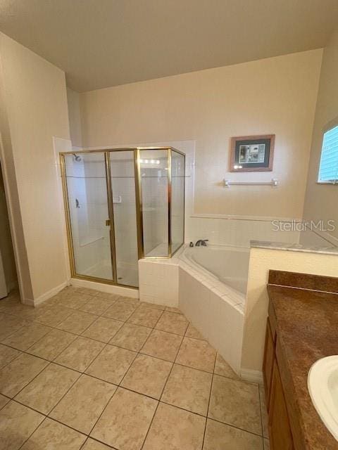 bathroom featuring separate shower and tub, tile patterned floors, and vanity