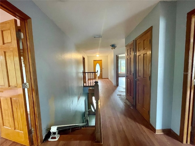 hallway featuring wood-type flooring