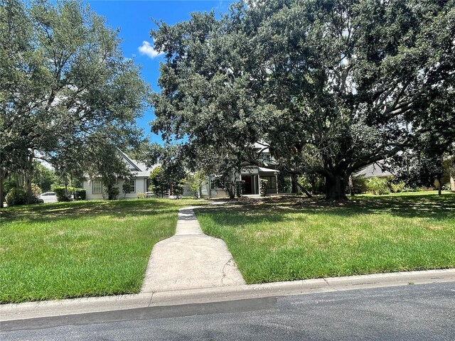 view of property hidden behind natural elements