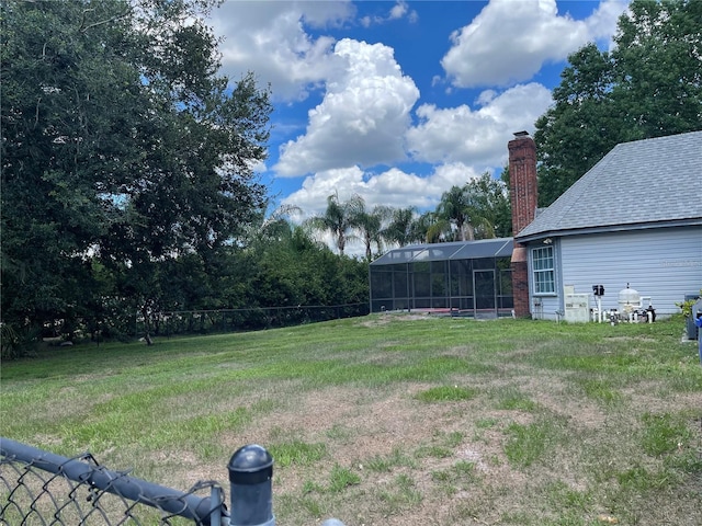 view of yard featuring a lanai