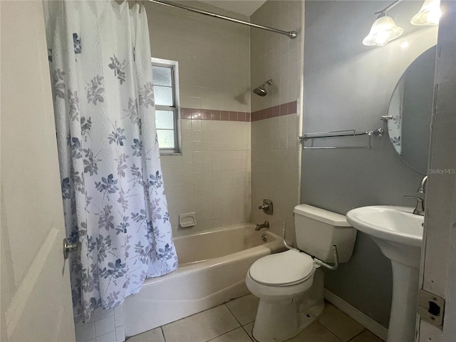 full bathroom with toilet, shower / tub combo, tile patterned flooring, and sink