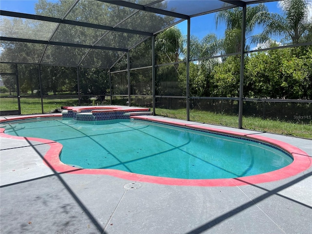 view of pool featuring an in ground hot tub and glass enclosure