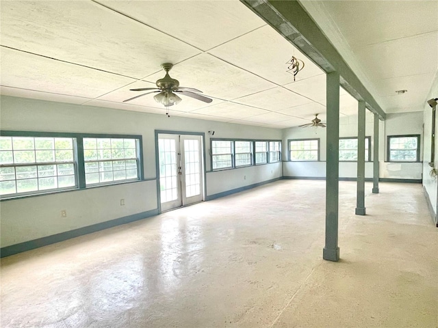 unfurnished room with concrete flooring and french doors