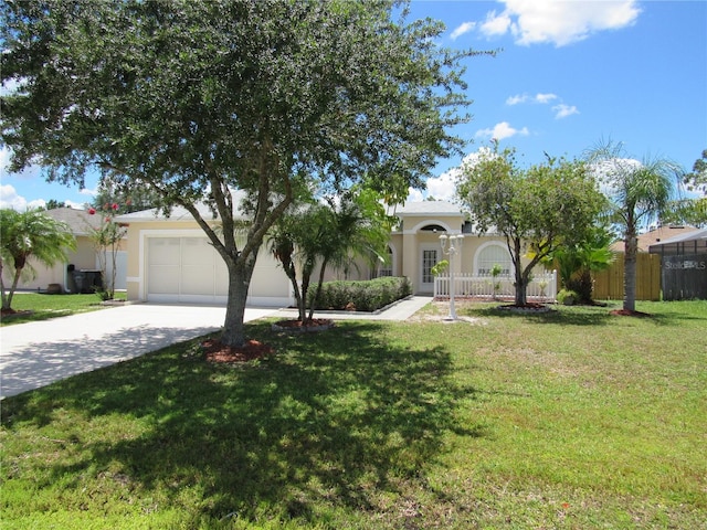 view of front of house featuring a garage and a front yard