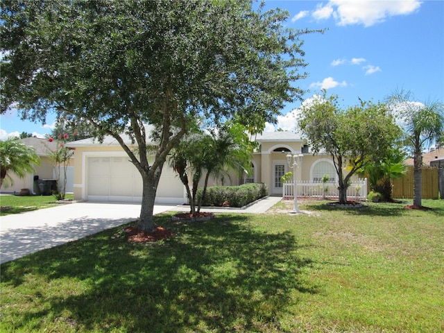 view of front of house featuring a garage and a front yard