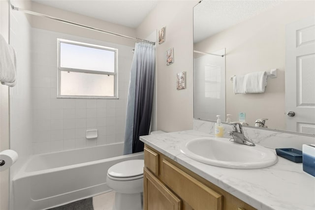 full bathroom featuring shower / bath combination with curtain, vanity, and toilet