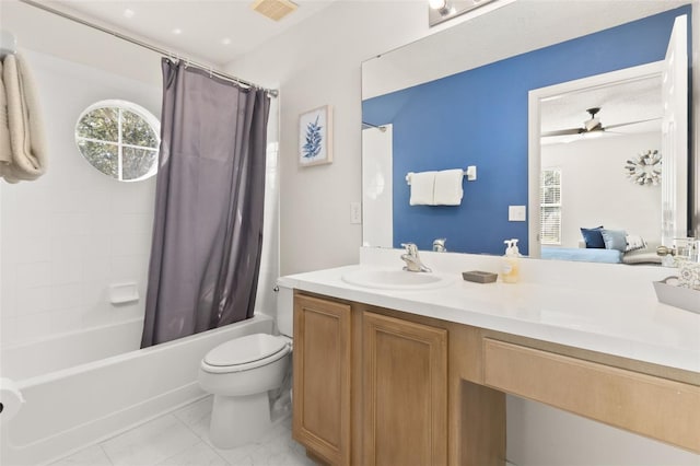 full bathroom featuring vanity, ceiling fan, toilet, a textured ceiling, and shower / tub combo