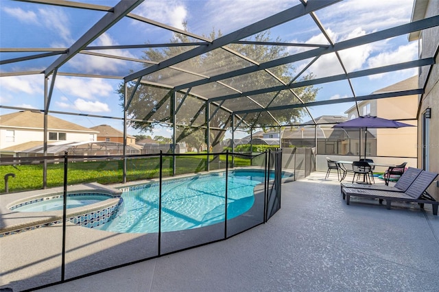 view of pool with a lanai, an in ground hot tub, and a patio