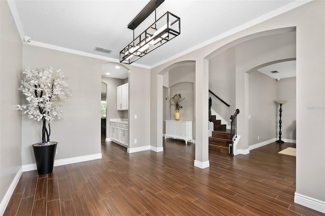 interior space with visible vents, baseboards, and dark wood-type flooring