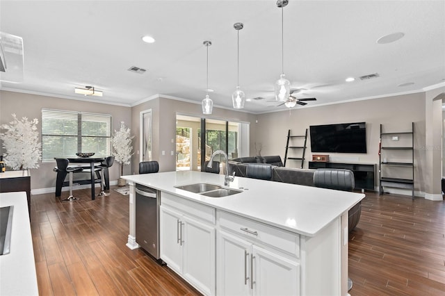 kitchen featuring sink, stainless steel dishwasher, crown molding, a kitchen island with sink, and white cabinets