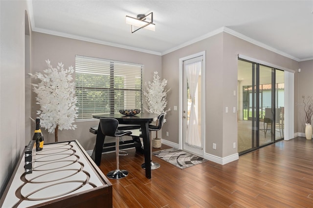 office with hardwood / wood-style flooring and crown molding