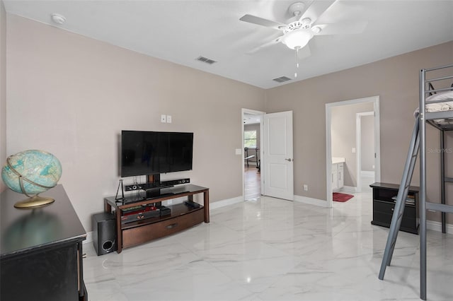 living room featuring baseboards, visible vents, marble finish floor, and ceiling fan