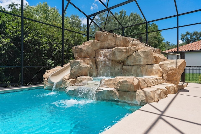 view of pool with pool water feature and a lanai