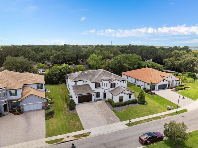 aerial view featuring a residential view and a view of trees